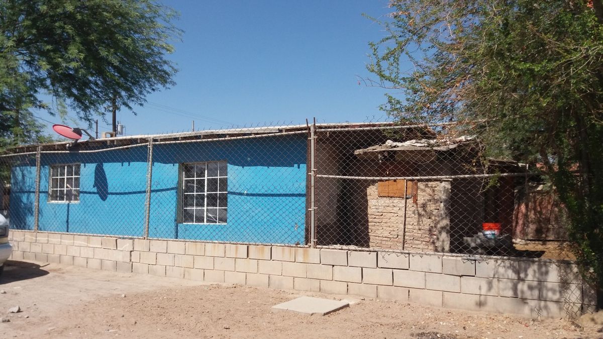 Terreno con casa en venta en Av. Nacionalistas.